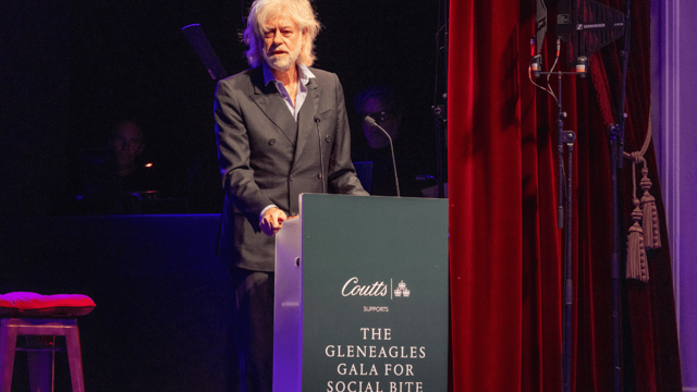 Bob Geldof speaks at a lectern that reads The Gleneagles Gala for Social Bite