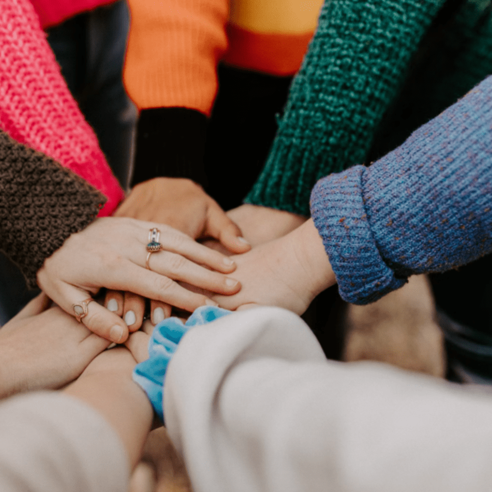 Women's hands on top of each other